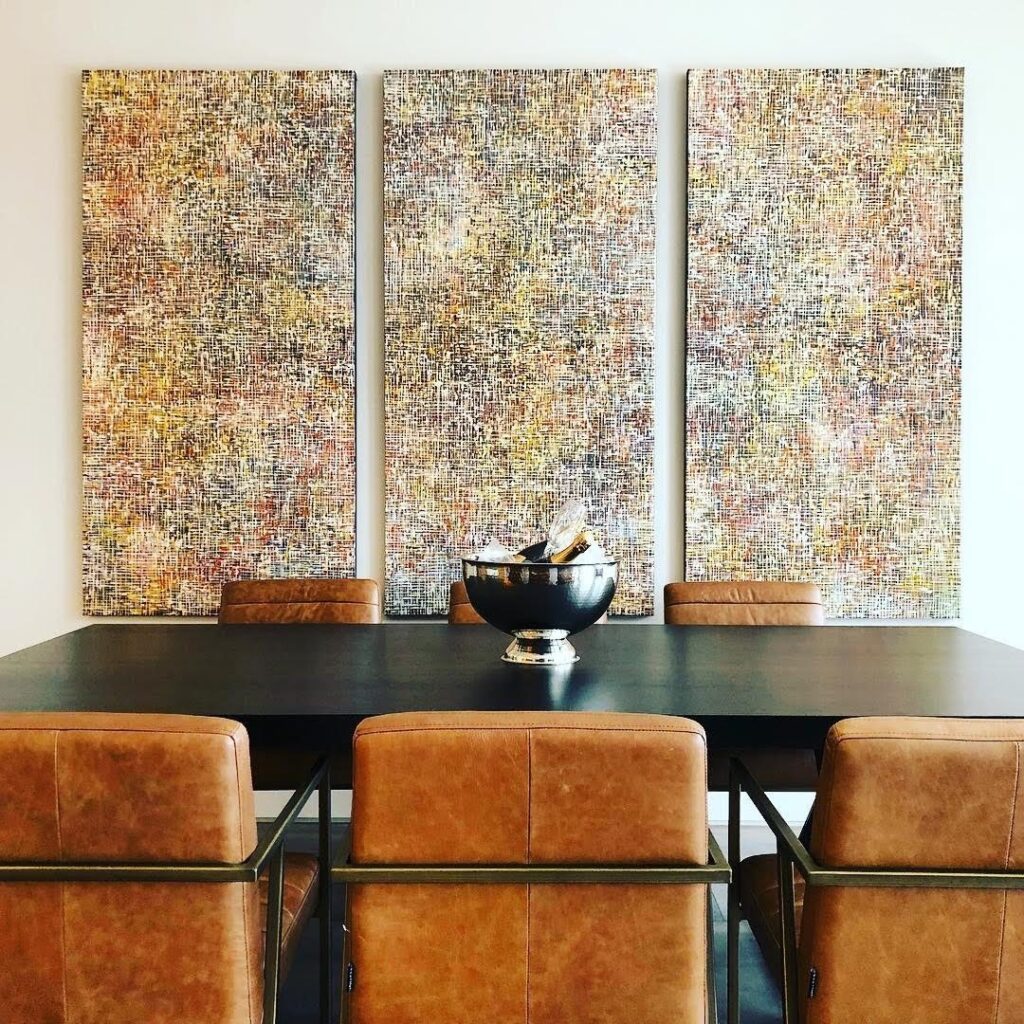 Wilson Lin's triptych artworks enhance the luxury decor in the dining room.