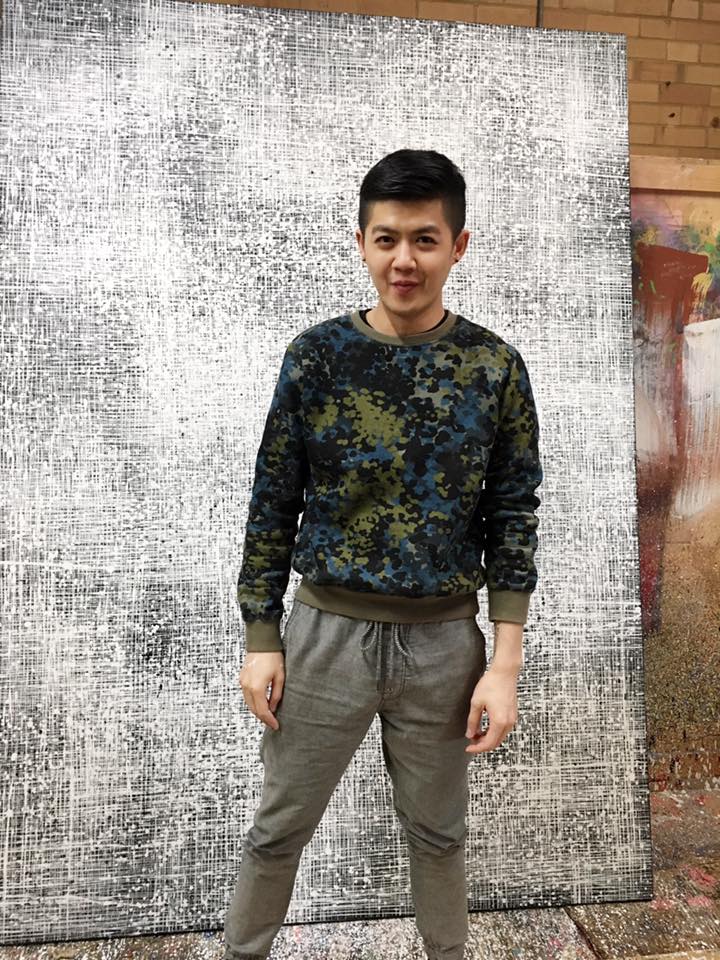 Wilson Lin in front of artwork